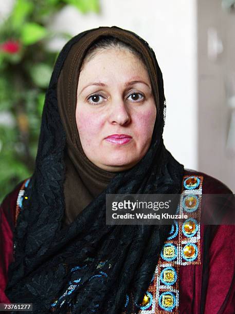 Um Ahmed, wife of Fuad Mosa Muhammad, looks on at her house on March 28, 2007 in Baghdad, Iraq. Fuad, a cook at a breakfast and lunch restaurant, was...