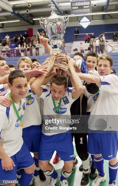 The members of SC Karlsruhe celebrate with the trophy after winning the Futsal Cup at the Sportschool Kaiserau on April 01, 2007 in Bergkamen,...