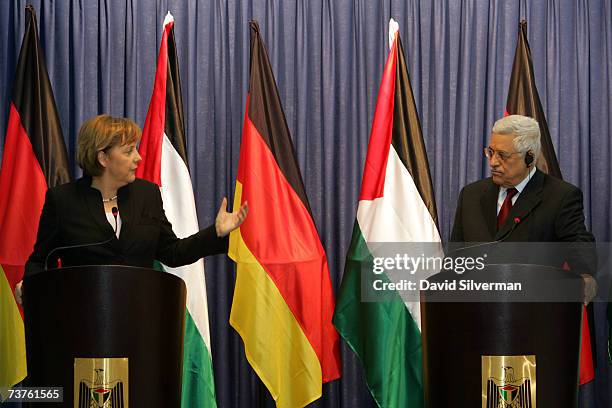 German Chancellor Angela Merkel gestures to Palestinian President Mahmoud Abbas during her joint press conference after their meeting in his...