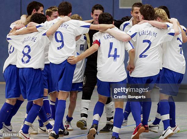 The members of SC Karlsruhe dance on the pitch after winning the Futsal Cup at the Sportschool Kaiserau on April 01, 2007 in Bergkamen, Germany.