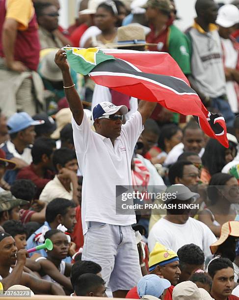 West India Cricket fan waves the flag while watching the World Cup Super Eight match between West Indies and Sri Lanka at Guyana National Stadium in...