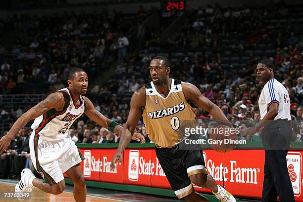 Gilbert Arenas of the Washington Wizards drives to the basket against Maurice Williams of the Milwaukee Bucks on April 1, 2007 at the Bradley Center...