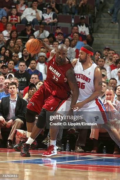 Shaquille O'Neal of the Miami Heat backs down Rasheed Wallace of the Detroit Pistons on April 1, 2007 at the Palace of Auburn Hills in Auburn Hills,...