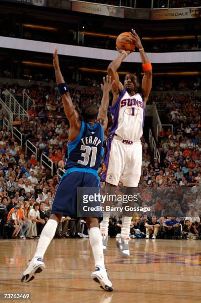 Amare Stoudemire of the Phoenix Suns shoots over the block of Jason Terry of the Dallas Mavericks on April 1, 2007 at U.S. Airways Center in Phoenix,...