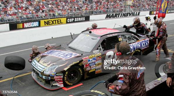 Snickers Dark Car Ricky Rudd Ricky Rudd, driver of the Snickers Ford, makes a pit stop during the ...