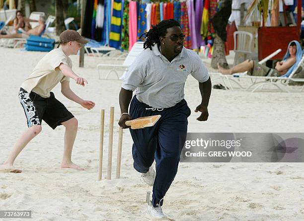 St John's, ANTIGUA AND BARBUDA: A friendly game of cricket is played out on the beach at the Jolly Harbour, near St John's on the Caribbean island of...