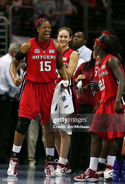 Kia Vaughn of the Rutgers Scarlet Knights celebrates from the bench with teammates against the LSU Lady Tigers during the National Semifinal game of...