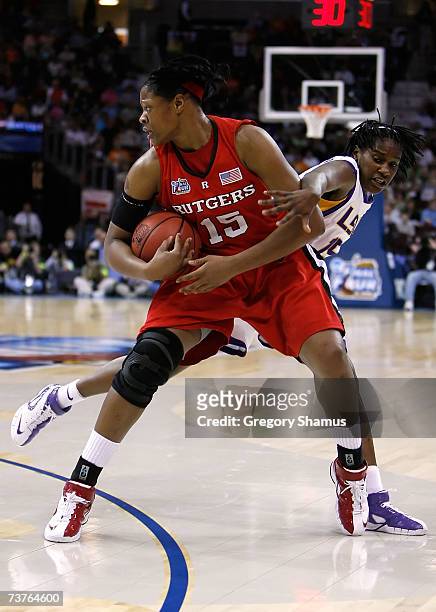 Kia Vaughn of the Rutgers Scarlet Knights controls the ball against Quianna Chaney of the LSU Lady Tigers during the National Semifinal game of the...