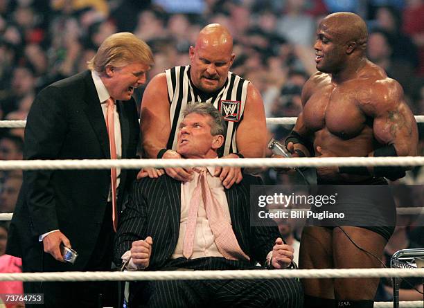 Chairman Vince McMahon has his head shaved by Donald Trump and Bobby Lashley while being held down by ''Stone Cold'' Steve Austin after losing a bet...