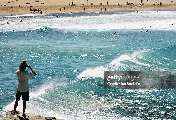 Man looks over Bondi Beach during the beach's closure following a tsunami warning on April 2, 2007 in Sydney, Australia. All of New South Wales'...