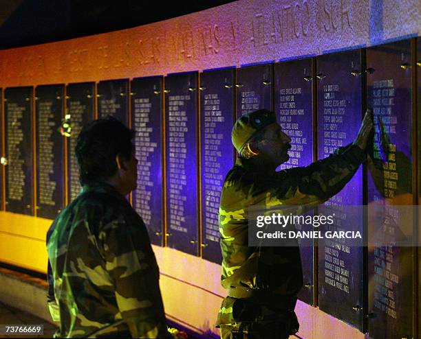 Buenos Aires, ARGENTINA: Veterans check names at the cenotaph for the Argentine soldiers killed in combat during the Malvinas/Falkland war in 1982...