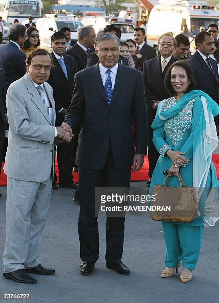 Pakistan Prime Minister Shaukat Aziz and his wife are welcomed by Indian Minister of Petroleum and Natural Gas, Murali Deora upon their arrival at...