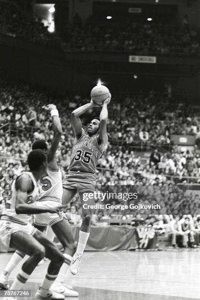 Forward Darrell Griffith of the Louisville Cardinals shoots during a college basketball game against the Ohio State Buckeyes at St. John Arena circa...