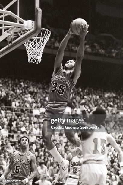 Forward Darrell Griffith of the Louisville Cardinals dunks during a college basketball game against the Ohio State Buckeyes at St. John Arena circa...