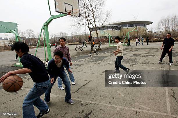 Students play basketball on the the campus of Jilin University on April 1, 2007 in Changchun of Jilin Province, China. Jilin University, a key...