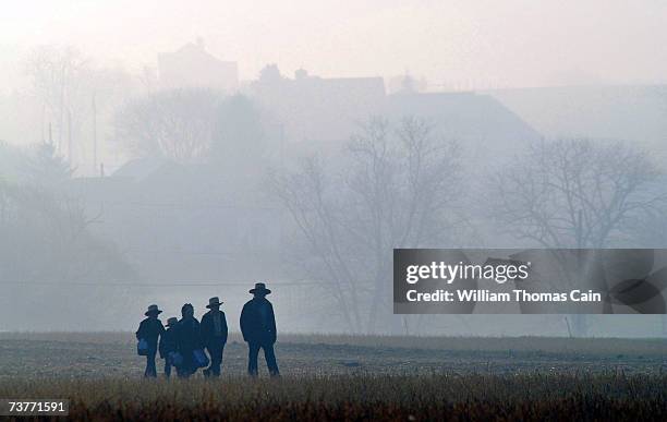 Amish children head to school April 2, 2007 in Nickel Mines, Pennsylvania. The school opened six months from the day, October 2 that ten of their...