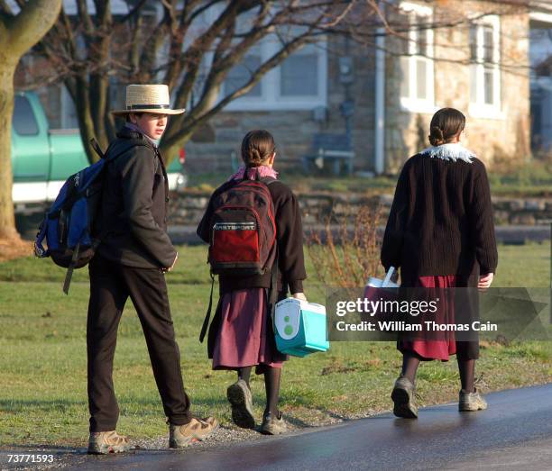 Amish children head to school April 2, 2007 in Nickel Mines, Pennsylvania. The school opened six months from the day, October 2 that ten of their...