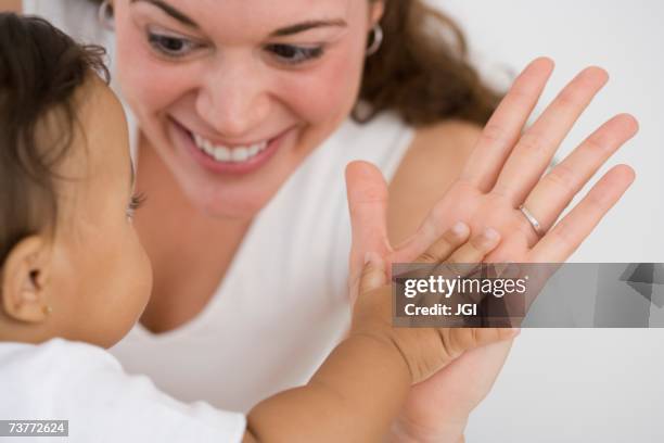 Clapping Mother Mom Clapping With Baby Photos and Premium High Res Pictures - Getty Images