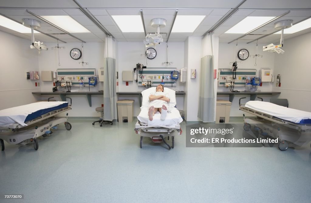 Male patient laying in hospital bed