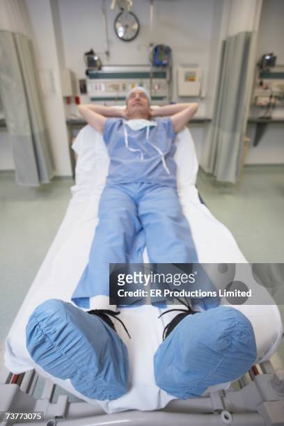 doctor sleeping in hospital bed - erbore stock pictures, royalty-free photos & images