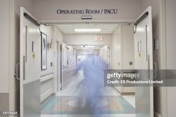 blurred motion shot in hospital corridor - er door stock pictures, royalty-free photos & images