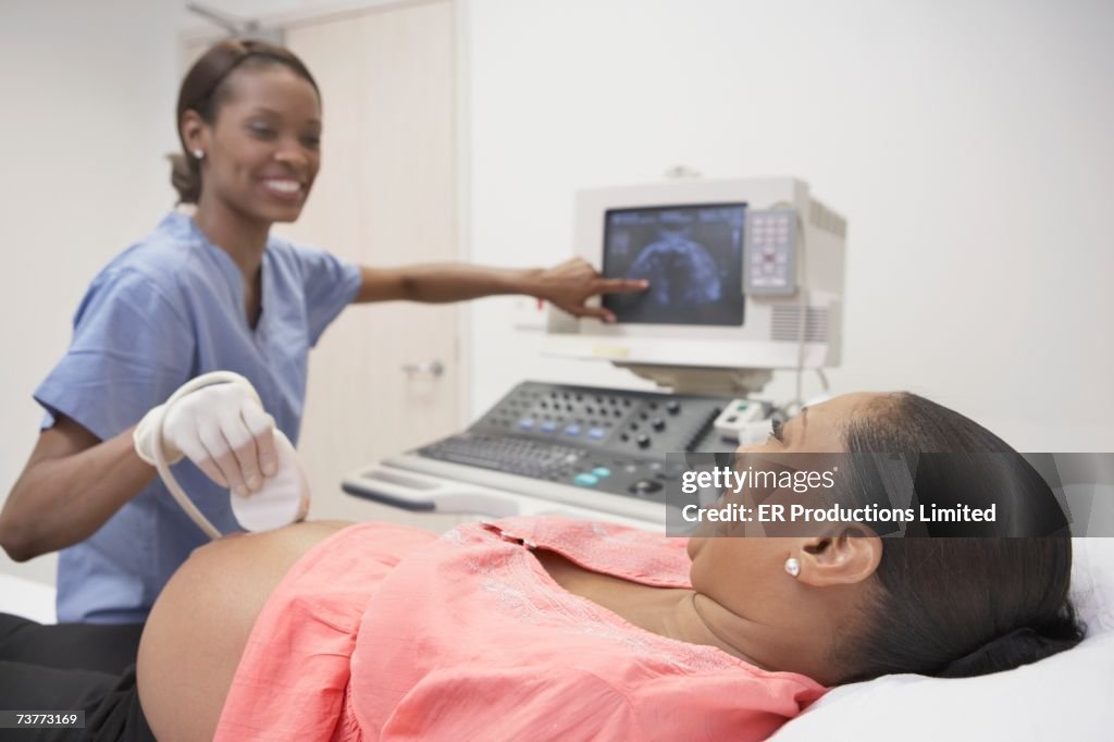 Pregnant African woman having ultrasound