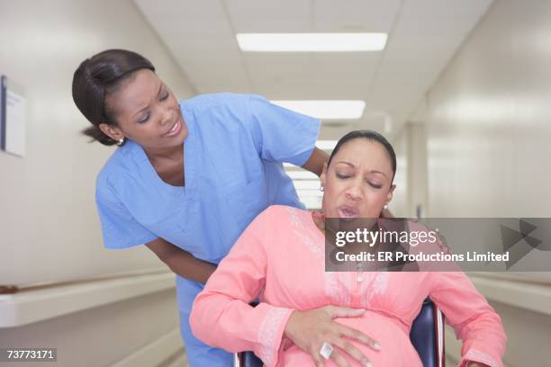 Woman In Labour Pregnant African Woman In Labor In Wheelchair High-Res Stock Photo ...