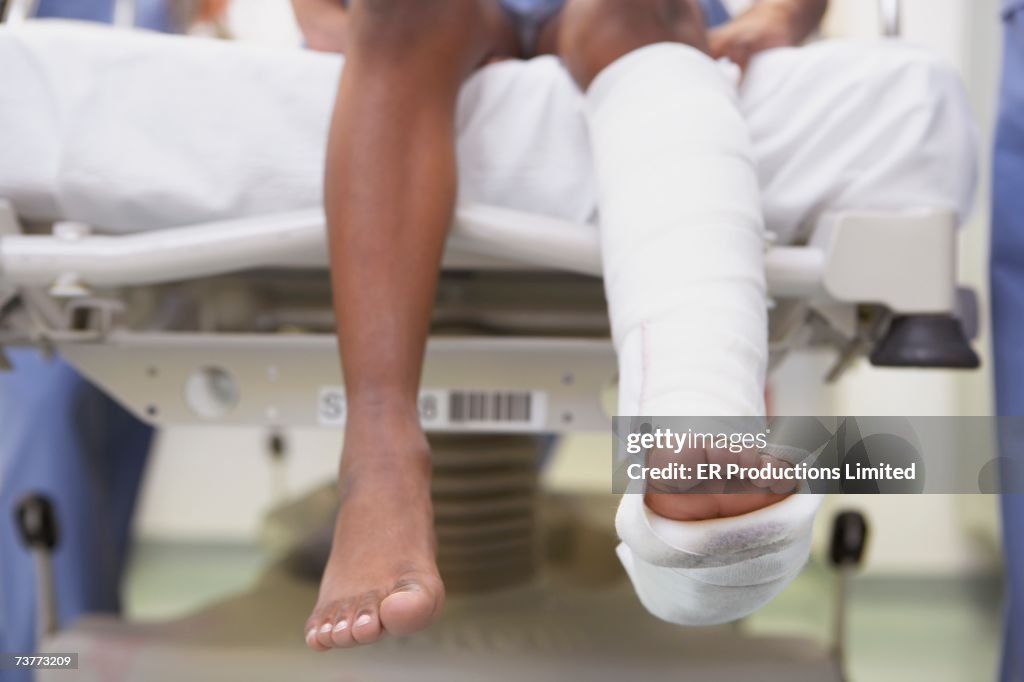 Close up of African boy with broken leg in hospital