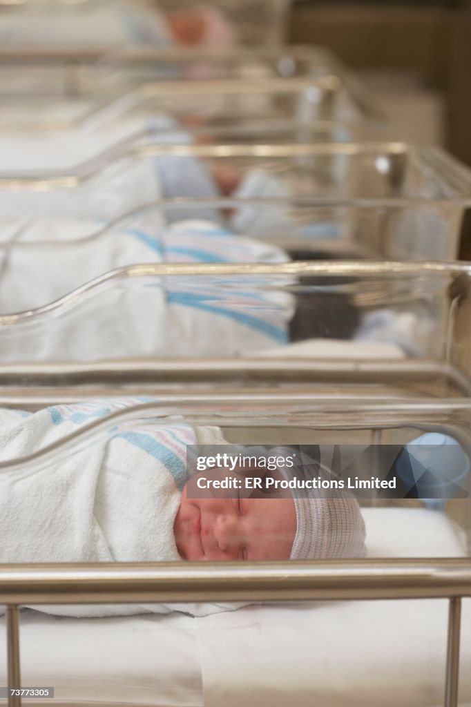 Newborn babies sleeping in hospital nursery