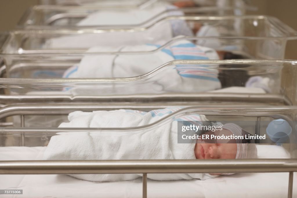 Newborn babies sleeping in hospital nursery
