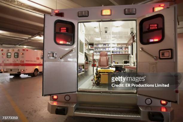 ambulance with back doors open - ambulance imagens e fotografias de stock
