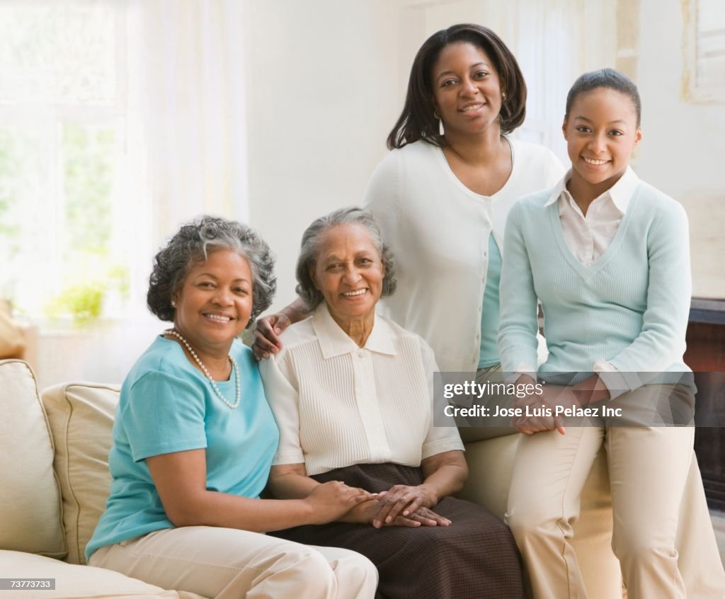 Multi-generational African women sitting on sofa