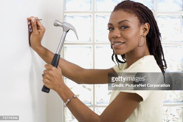 405 Woman Hammering A Nail Photos and Premium High Res Pictures - Getty  Images