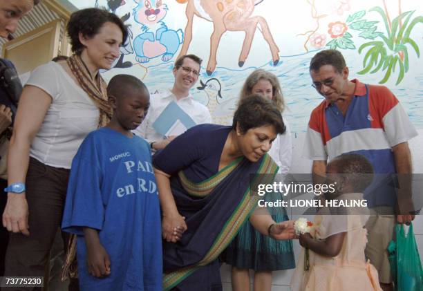 Goma, Democratic Republic of the Congo: Radhika Coomaraswamy , Special UN Representative for Children in Armed Conflict, receives flowers from a...