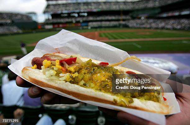 Fan has a loaded hotdog at the ready to celebrate Opening Day as the Arizona Diamondbacks face off against the Colorado Rockies on April 2, 2007 at...