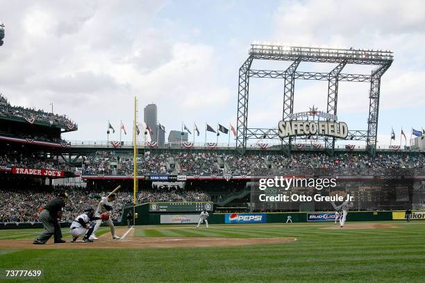 Starting Pitcher Felix Hernandez of the Seattle Mariners throws the first pitch of the game against Jason Kendall of the Oakland A's on opening day...