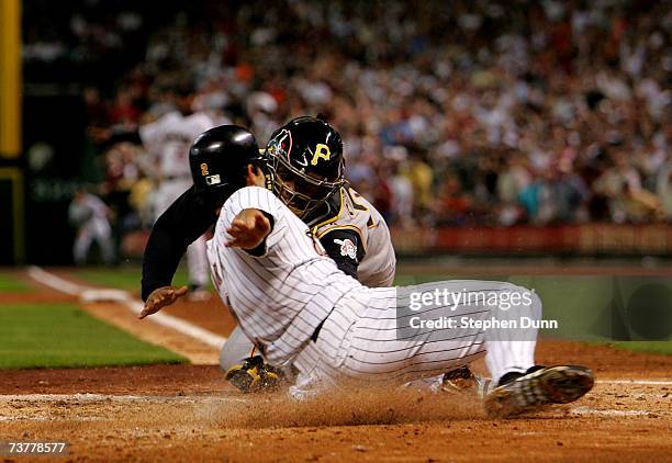 Catcher Ronny Paulino of the Pittsburgh Pirates tags out Chris Burke of the Houston Astros on April 2, 2007 at Minute Maid Park in Houston, Texas.