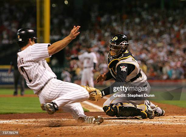 Catcher Ronny Paulino of the Pittsburgh Pirates tags out Chris Burke of the Houston Astros on April 2, 2007 at Minute Maid Park in Houston, Texas.