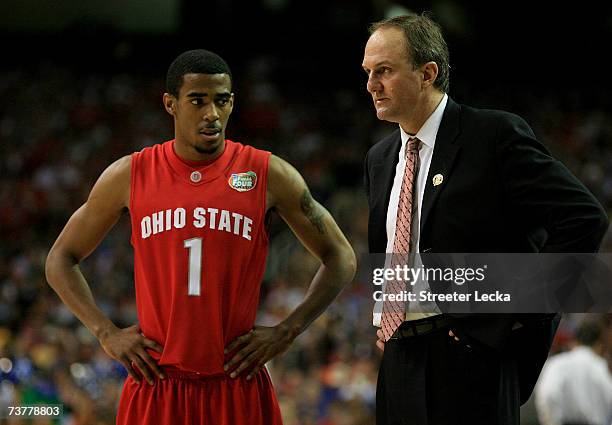 Head coach Thad Matta of the Ohio State Buckeyes talks with Mike Conley Jr during the NCAA Men's Basketball Championship game against the Florida...