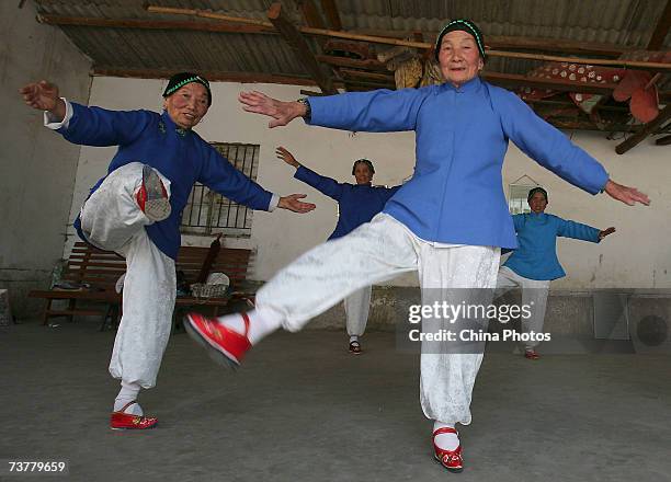 Members of the Bound Feet Women Dancing Team, practise dancing at Liuyi Village on April 2, 2007 in Tonghai County of Yunnan Province, China. Liuyi...