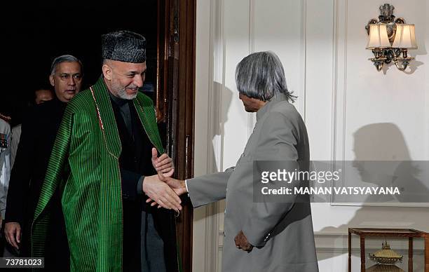 Indian President A.P.J.Abdul Kalam welcomes Afghan President Hamid Karzai for a meeting at the Presidential Palace in New Delhi, 03 April 2007 on the...