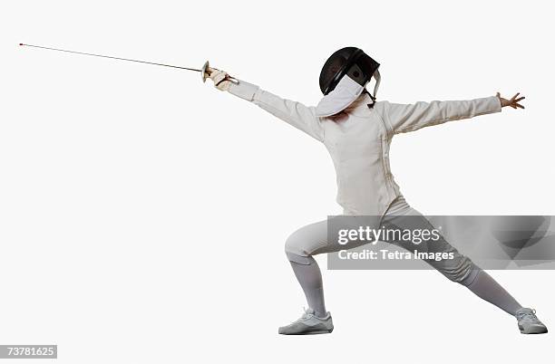 studio shot of person in fencing outfit - tirador fotografías e imágenes de stock