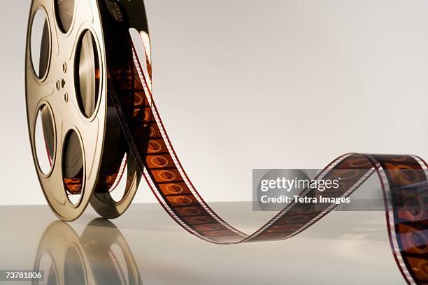 close up of reel of movie film - cinta de película fotografías e imágenes de stock