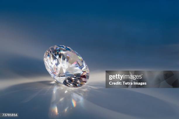 close-up of a sparkly clear faceted gem - brillante foto e immagini stock