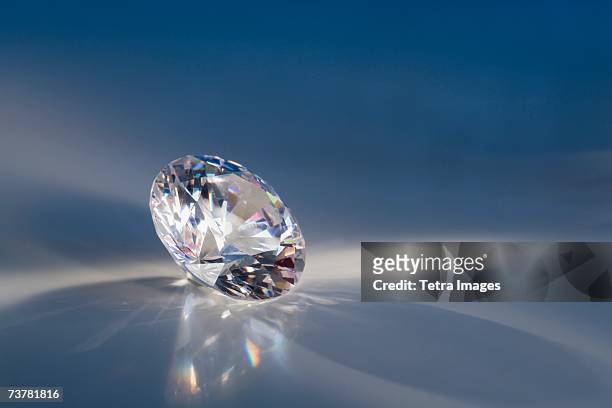 close-up of a sparkly clear faceted gem - diamond ストックフォトと画像