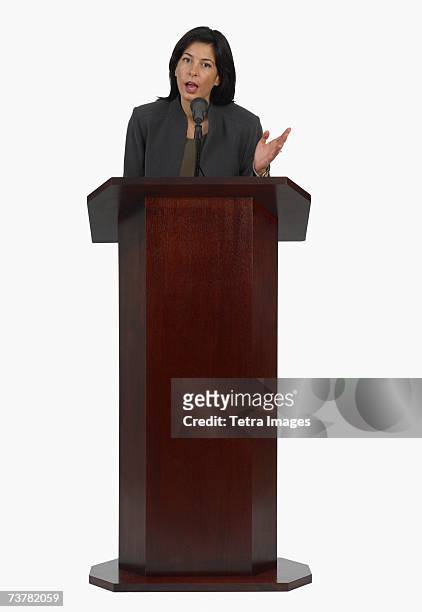 businesswoman speaking at podium - lectern stock pictures, royalty-free photos & images