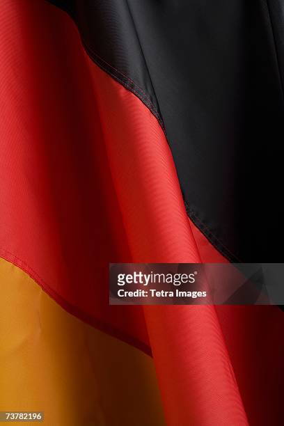 close up of flag of germany - german flag wallpaper stock-fotos und bilder