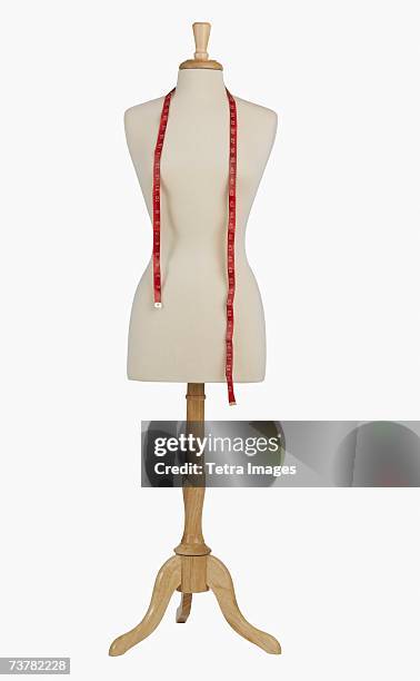 studio shot of dress dummy and tape measure - mannequin imagens e fotografias de stock