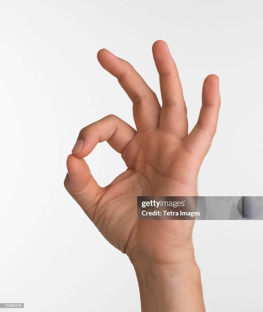 Okay Sign Leg Studio Shot Of Hand Giving The Okay Sign High-Res Stock Photo - Getty ...