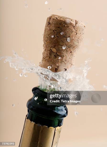 close up of champagne cork popping - wine cork stock pictures, royalty-free photos & images